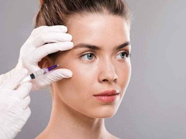 Beautiful woman receiveing beauty injections