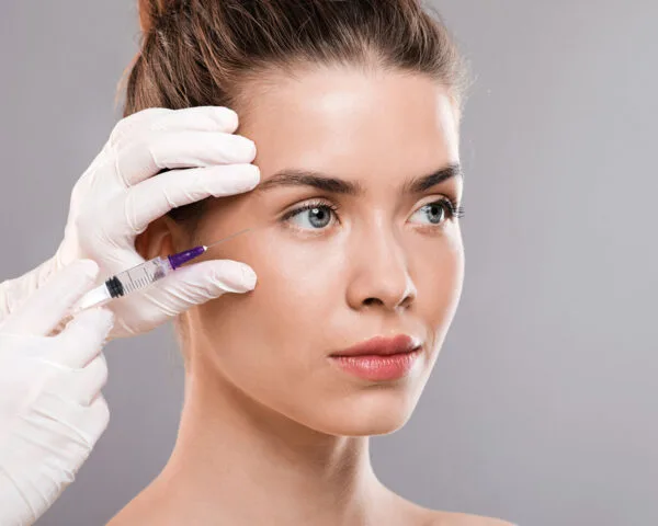 beautiful woman getting facial injections