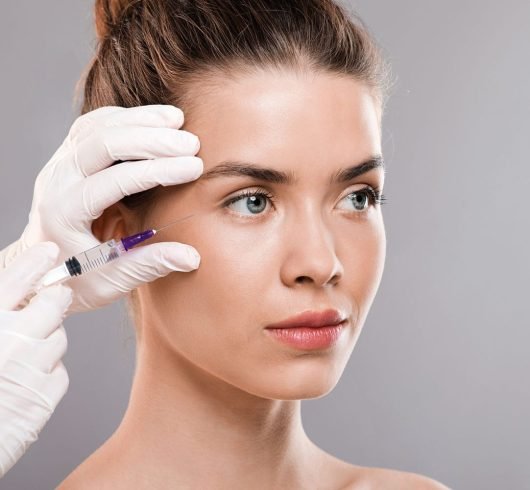 Beautiful woman receiveing beauty injections